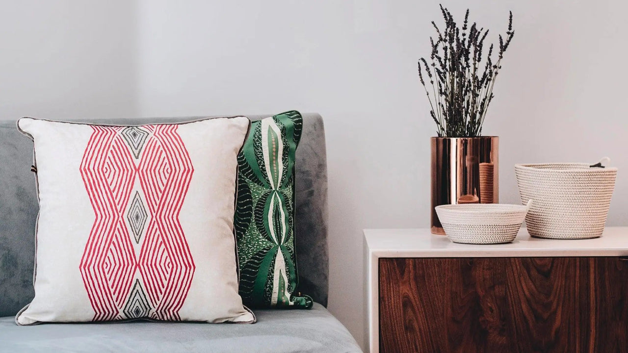 Layer colorful accents in your living room with handmade African throw pillows like the Odi Pink Throw Pillows for couch, bed, and more.